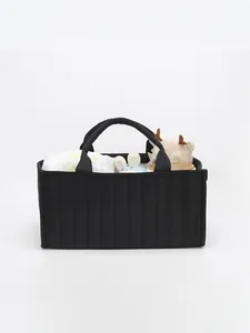 Minimalist black quilted tote bag with large capacity for baby storage and daily commuting