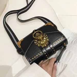Black street style shoulder bag with gold lion head hardware and striped strap