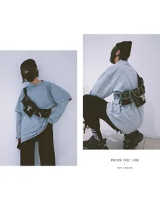 Front and side view of a black tactical chest bag with multiple pockets on a grey sweatshirt