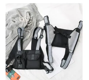 Detail of tactical chest bag showing reflective straps and breathable mesh backing
