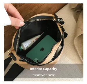 Interior view showing the large capacity of the khaki crossbody bag with a smartphone