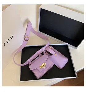 Detail of lavender synthetic leather waist bag set with gold hardware and two pouches