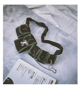 Close-up of tactical chest bag with multi-pocket mesh design and metal chain details