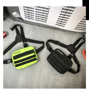 Flat lay detail of street-style tactical chest bags in neon green and black nylon fabric