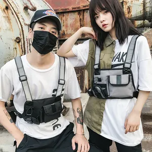 Tactical chest bag with reflective straps in functional techwear style for men and women