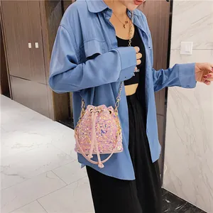 Pink sequin bucket bag for women with golden metal chain strap and drawstring closure