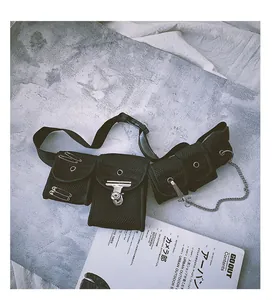 Detail of black mesh utility belt bag with metal chains and punk accessories