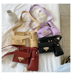 Flat lay of colorful leather waist bags with belt in yellow, purple, black and red
