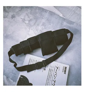 Detailed view of black tactical mesh waist bag with three storage pockets and buckle belt