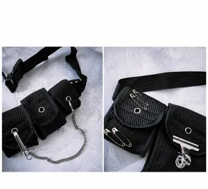 Detail of black tactical crossbody bag with mesh pockets and industrial metal chains