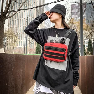 Waterproof red nylon chest bag with black webbing straps and adjustable buckle