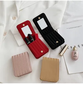 Close-up of mini mirror makeup bags in four colors with magnetic flap and dual lipstick slots