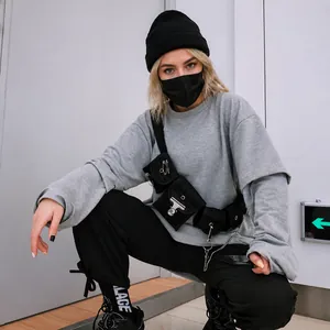 Hip hop tactical chest bag in grey and black streetwear outfit with chain detail