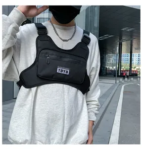Detailed view of black tactical chest rig bag with adjustable straps and TDYU logo patch