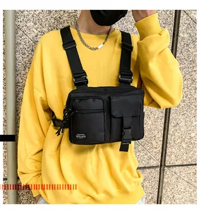 Tactical black nylon chest bag with adjustable wide straps and buckles on a male model