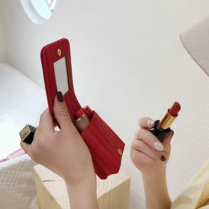 Portable red striped lipstick case with built-in mirror and magnetic closure
