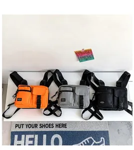 Nylon tactical chest bags in orange, grey, and black featuring multi-pocket utility design
