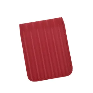 Deep red textured leather mini wallet with magnetic flap and vertical ribbing patterns