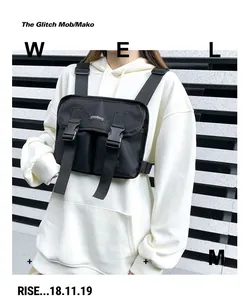 Detailed view of black tactical chest bag with dual buckles and adjustable straps