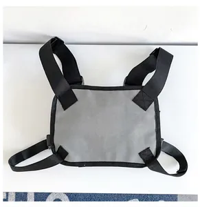 Detailed view of gray tactical chest rig featuring adjustable straps and durable nylon