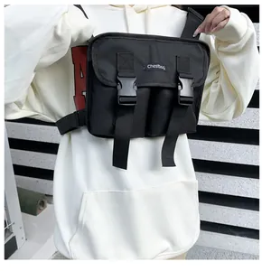 Close-up of black tactical chest bag featuring buckle closures and nylon utility pockets