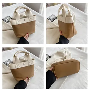 Viste dettagliate di una borsa tote in pelle PU bicolore con bottone a pressione e base solida