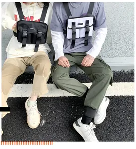 Detailed close-up of tactical nylon chest bags with dual buckle pockets in street style