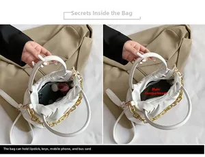 Internal view of white PU bag showing capacity for phone, lipstick, and essentials