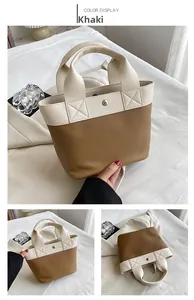Dettaglio della borsa tote in PU bicolore kaki con trama martellata e chiusura magnetica