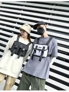 Close-up of tactical chest bag with heavy-duty buckles in black and white colors
