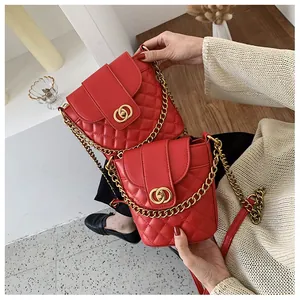 Detailed comparison of large and small red quilted bucket bags with gold chain straps