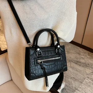 Classic black crocodile pattern PU leather shoulder bag with tassels and silver metal hardware