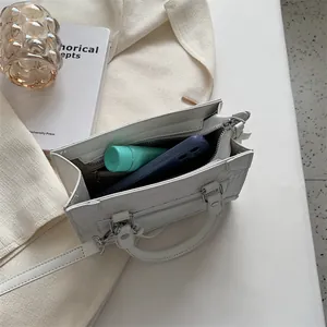 White faux crocodile embossed shoulder bag with interior view showing large capacity