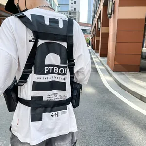 Tactical black chest rig bag for men styled with casual street style printed t-shirt