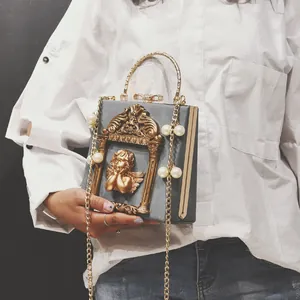 Vintage gray square handbag with golden angel relief, pearl chain and metal handle