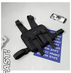 Detail of durable black tactical chest bag with adjustable straps and quick-release buckles