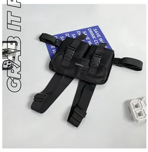 Tactical black chest bag detail showing dual buckles and adjustable nylon straps