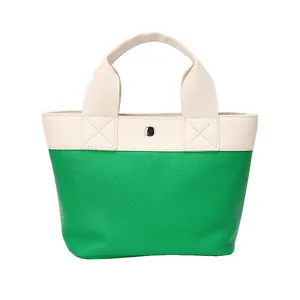 Borsa tote bicolore verde e bianca in ecopelle con trama a grana fine
