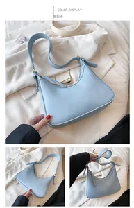 Detail of light blue PU leather hobo bag showing adjustable strap and golden metal buckle