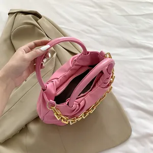 Pink PU leather handbag with elegant pleated design and decorative chunky gold chain