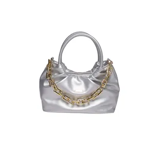 Metallic silver PU shoulder bag with ruched design and decorative gold chain strap