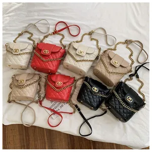 Detailed overhead view of quilted leather bucket bags with gold twist locks and chain straps