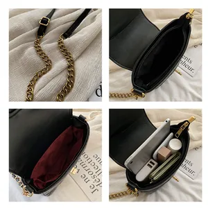 Black quilted bucket bag with gold chain strap and spacious interior for essentials