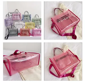 Detail showing various colors of transparent PVC tote bags with mesh texture and wide straps