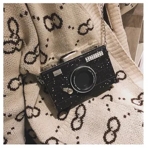Unique camera-shaped crossbody bag in black glitter with gold chain strap