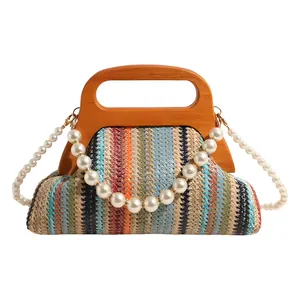 Colorful striped woven handbag with a wooden handle and pearl chain shoulder strap