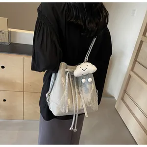 Detail of light gray marble pattern bucket bag with cute plush cloud charm on back view