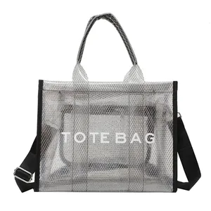 Silver metallic grid tote bag with black strap and white TOTE BAG lettering text