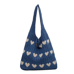 Knitted heart pattern tote bag in navy blue with cream white hearts and long shoulder strap