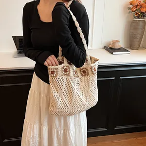 Chic cream crochet tote bag with floral granny square patterns and hollow mesh design